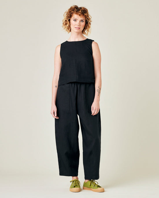 model wears black linen huxley trousers