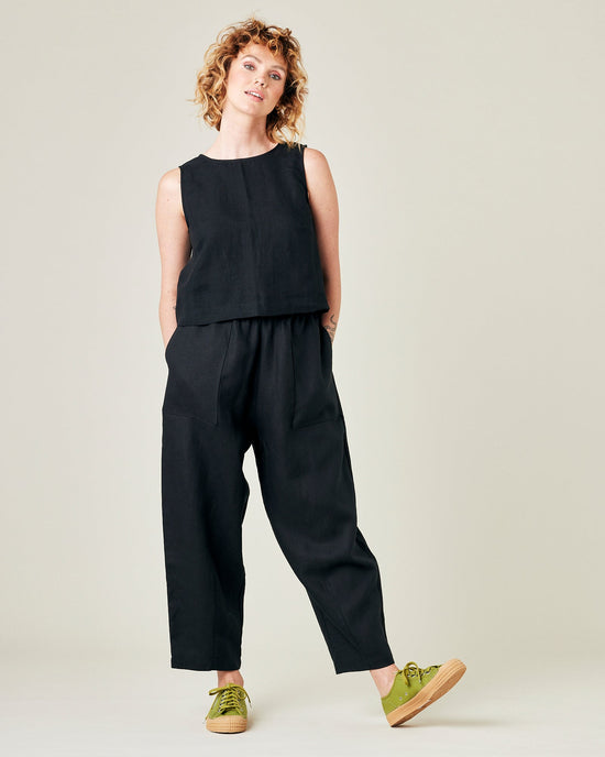 model wears black linen huxley trousers