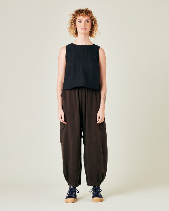 model wears espresso cupro sylvie trousers