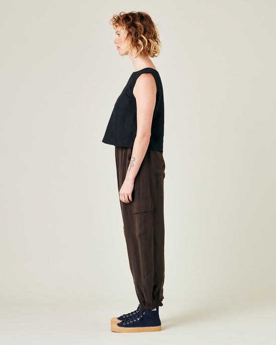 model wears espresso cupro sylvie trousers