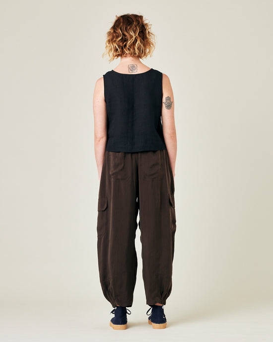 model wears espresso cupro sylvie trousers