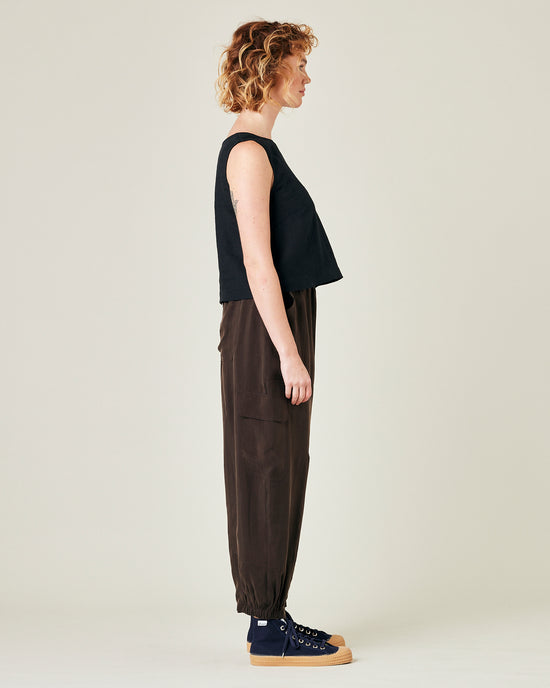 model wears espresso cupro sylvie trousers