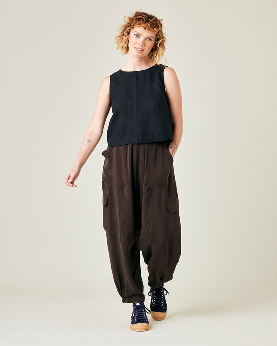 model wears espresso cupro sylvie trousers