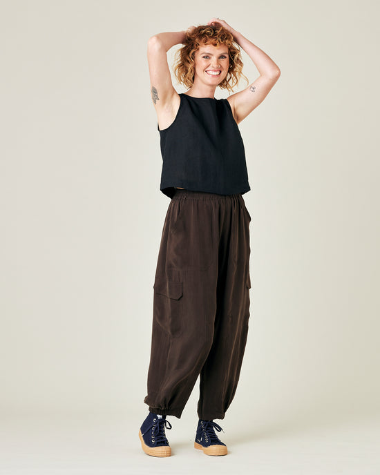 model wears espresso cupro sylvie trousers