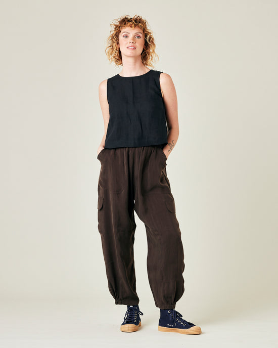 model wears espresso cupro sylvie trousers