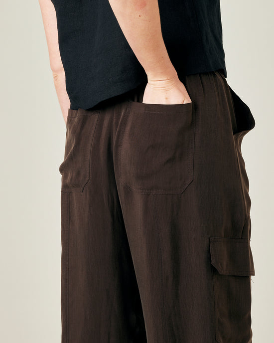 model wears espresso cupro sylvie trousers