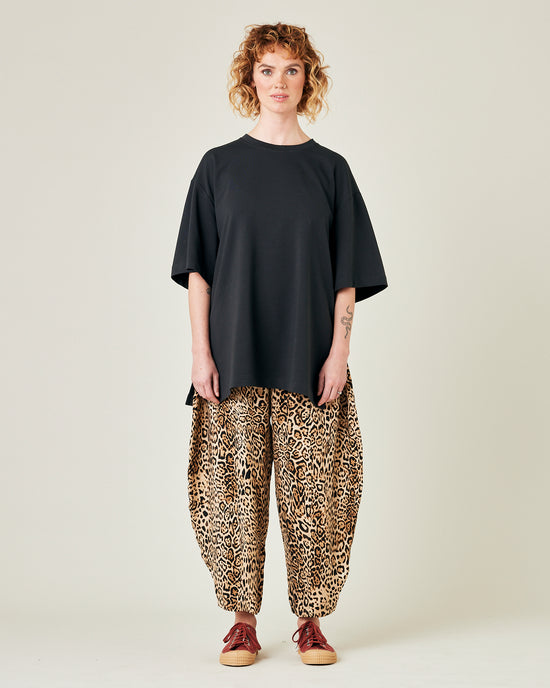 model wears leopard print cupro mabel trousers