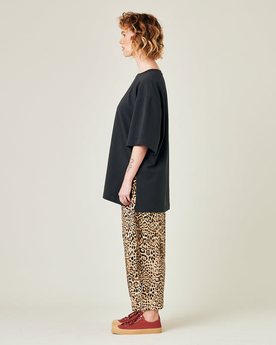 model wears leopard print cupro mabel trousers