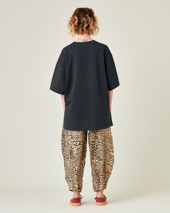 model wears leopard print cupro mabel trousers