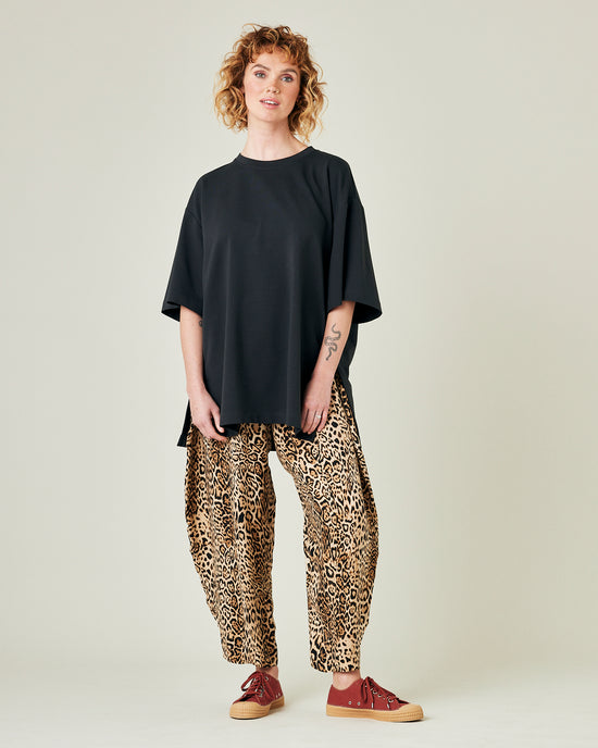 model wears leopard print cupro mabel trousers