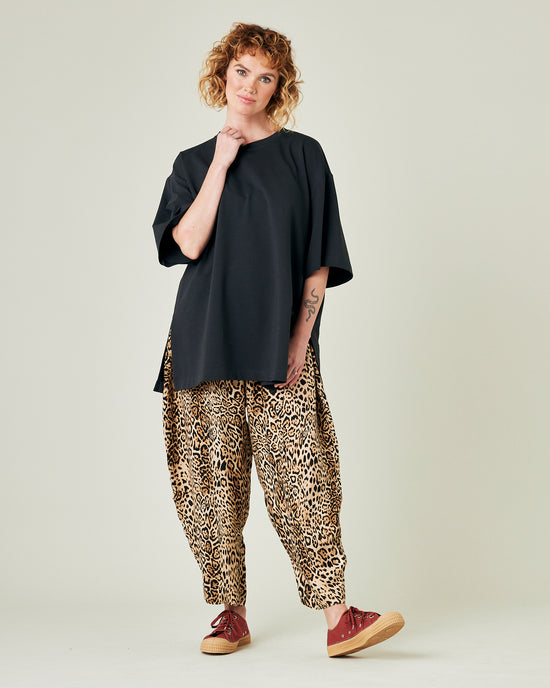 model wears leopard print cupro mabel trousers