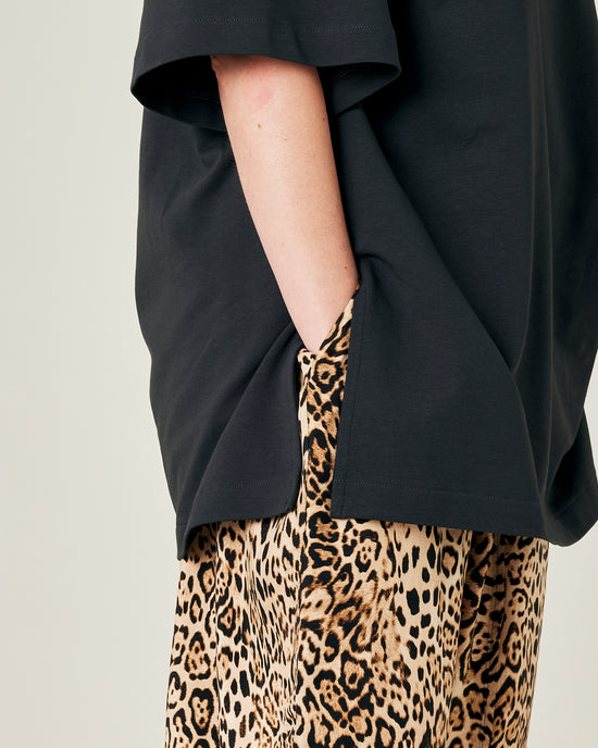 model wears leopard print cupro mabel trousers