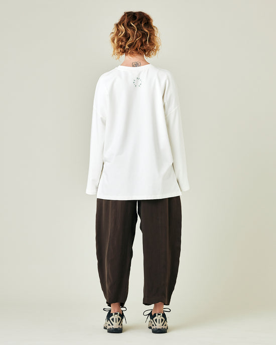 model wears espresso cupro mabel trousers