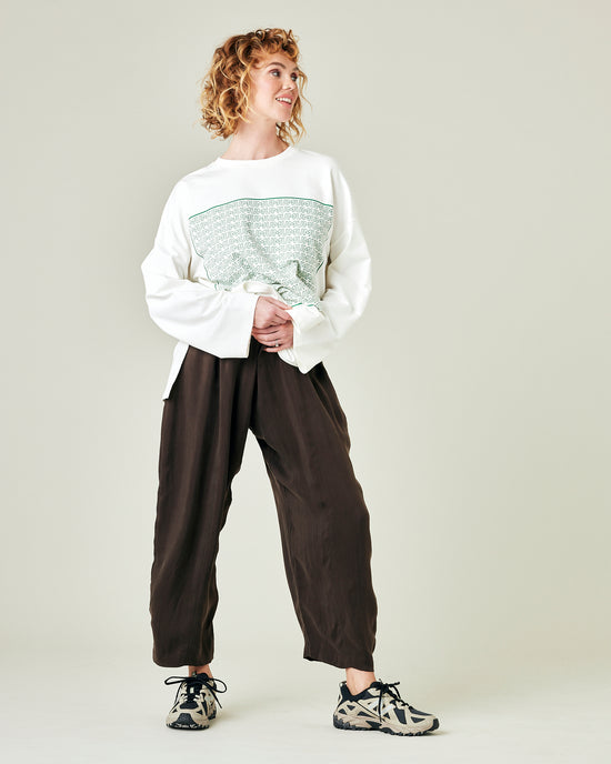 model wears espresso cupro mabel trousers