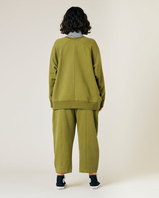 model wears jenny avocado fleece jersey trousers