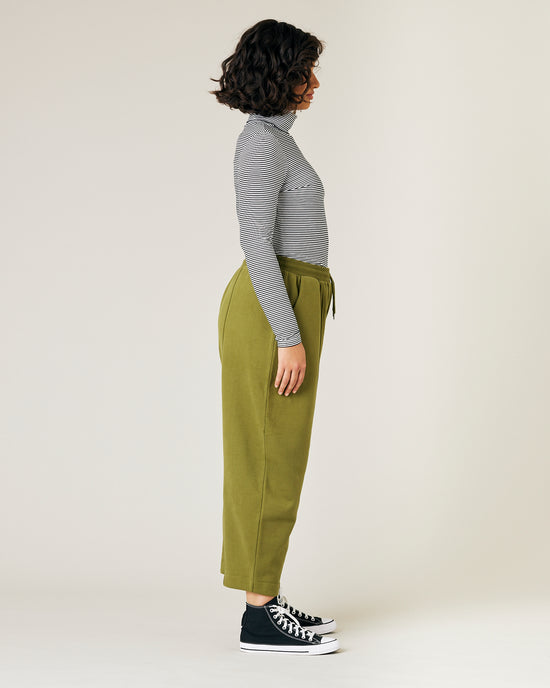 model wears jenny avocado fleece jersey trousers