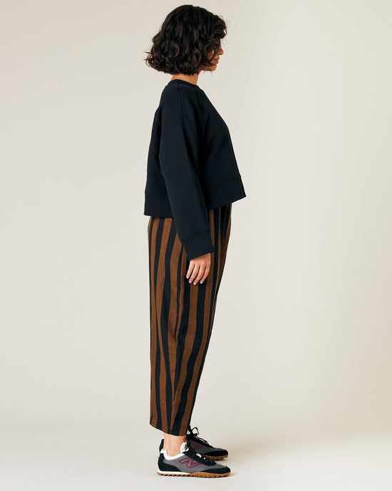 model wears rust stripe linen mabel trousers