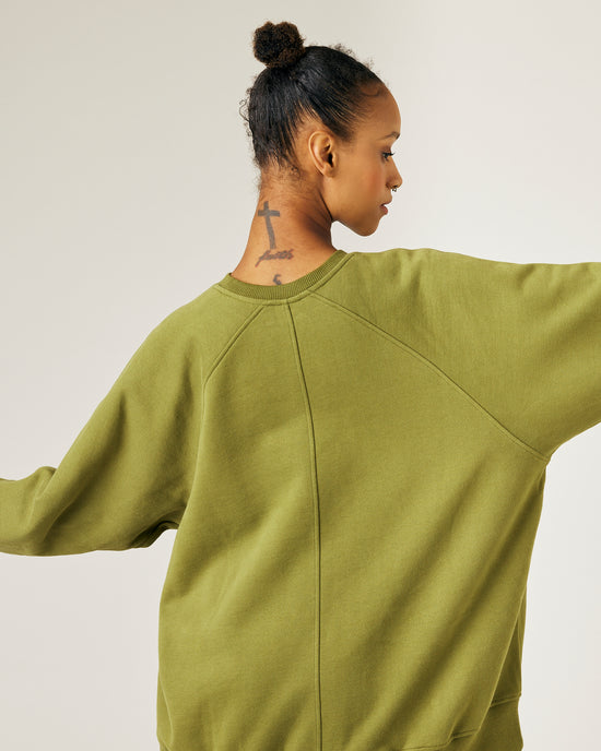 pregnant model wears avocado fleece jersey hugh jumper