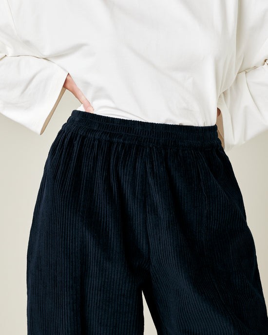 model wears true navy cord mabel trousers