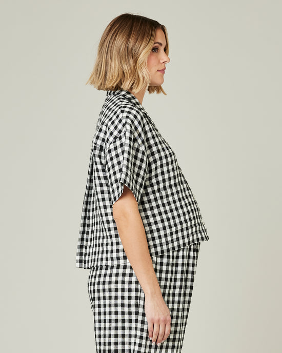 pregnant model wears black and white gingham linen pj top 