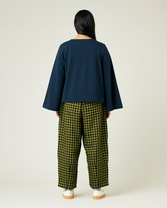 model wears green gingham huxley trousers