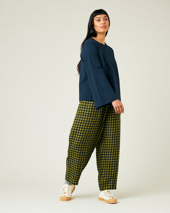 model wears green gingham huxley trousers