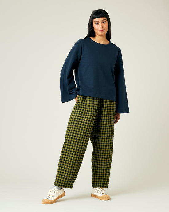 model wears green gingham huxley trousers