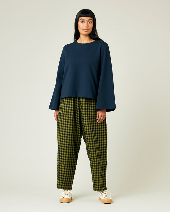 model wears green gingham huxley trousers