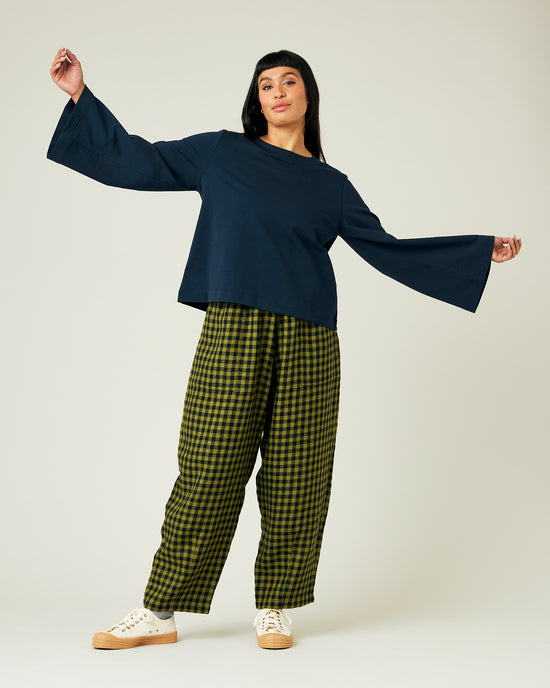 model wears green gingham huxley trousers