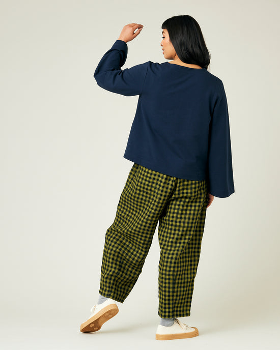 model wears green gingham huxley trousers