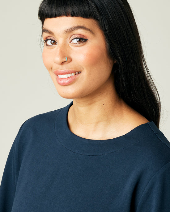 model wears navy jersey wren top