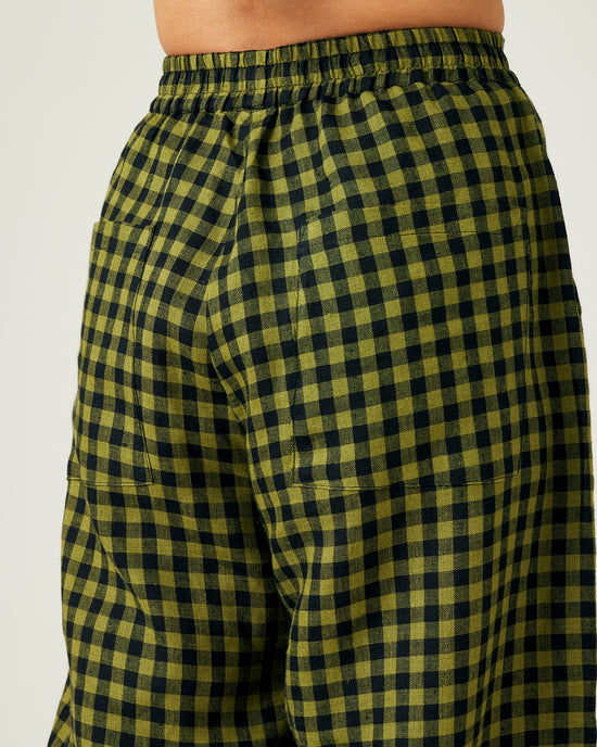 model wears green gingham huxley trousers