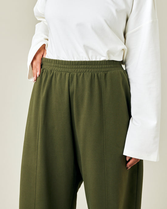 model wears olive jersey mabel trousers