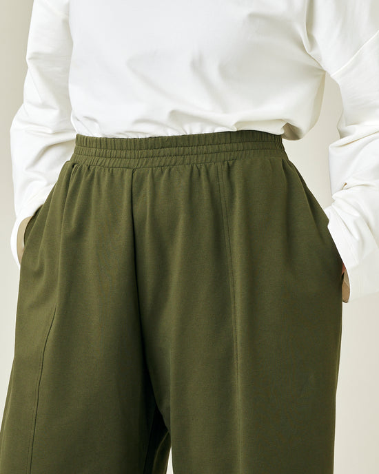 model wears olive jersey mabel trousers