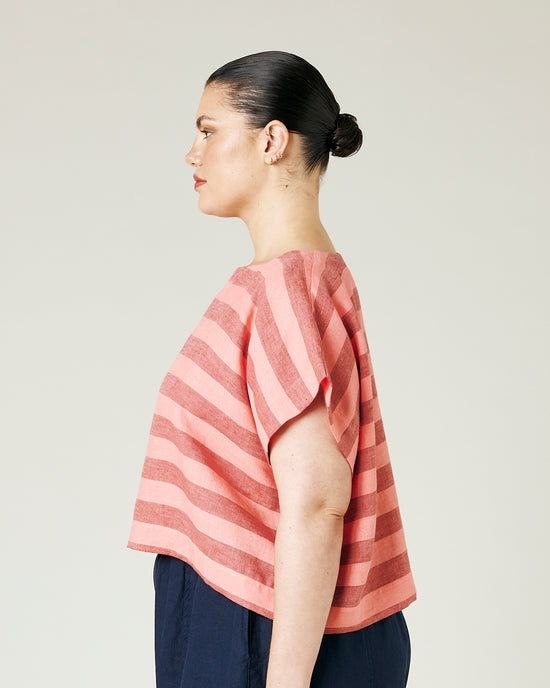 model wears blush stripe linen polly top