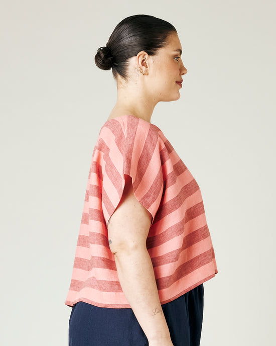 model wears blush stripe linen polly top