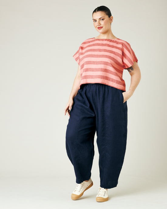 model wears blush stripe linen polly top