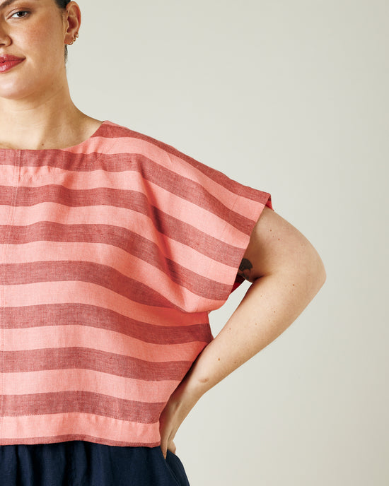 model wears blush stripe linen polly top