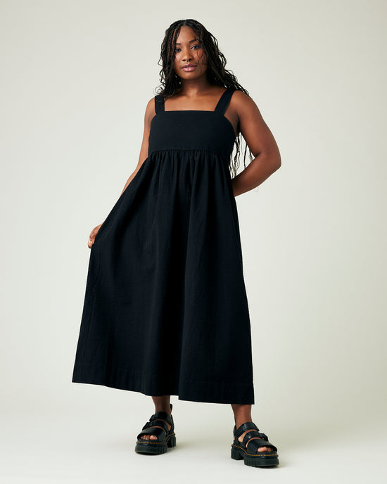 model wears black seersucker suki dress