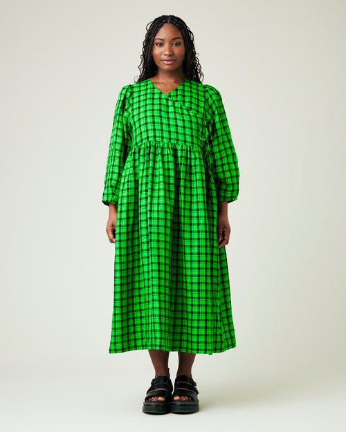 model wears green and black check linen isabel dress