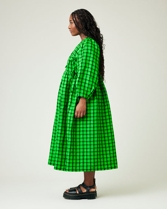 model wears green and black check linen isabel dress