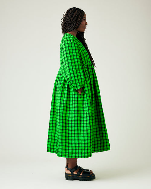 model wears green and black check linen isabel dress