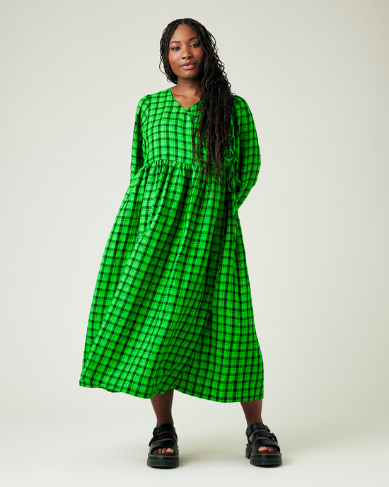 model wears green and black check linen isabel dress