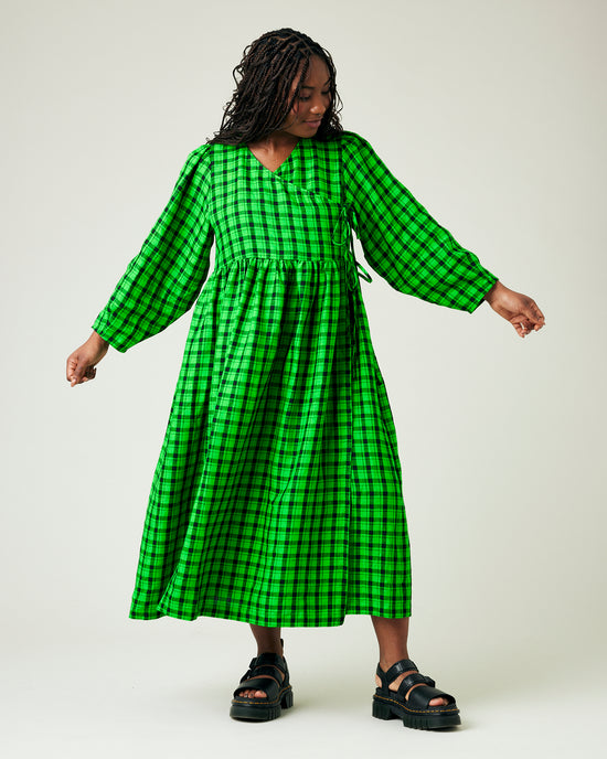 model wears green and black check linen isabel dress