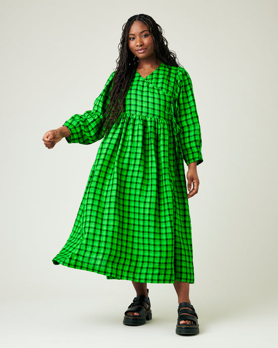 model wears green and black check linen isabel dress