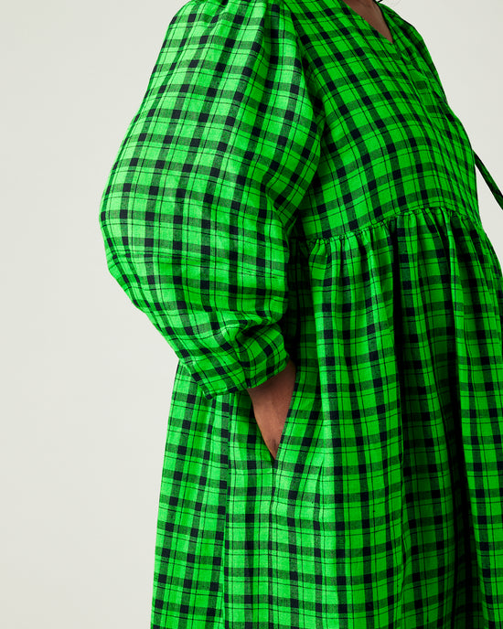 model wears green and black check linen isabel dress