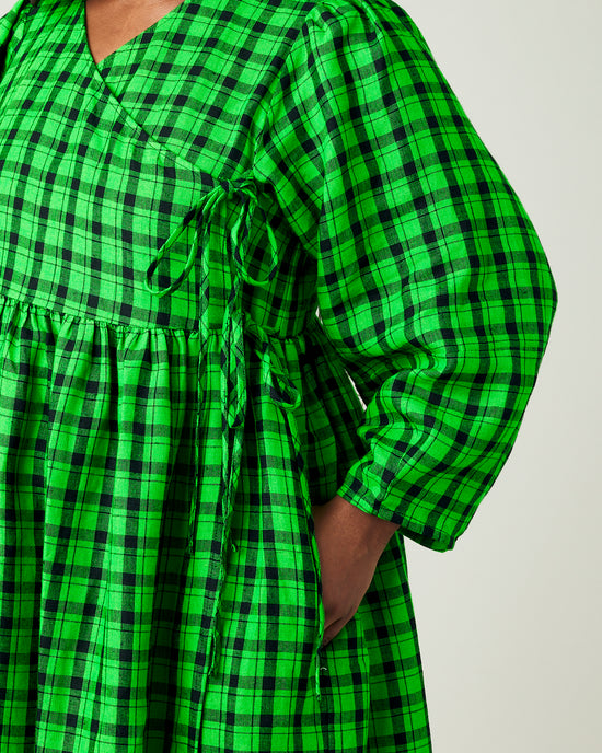 model wears green and black check linen isabel dress