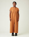 model wears rust linen sahara jumpsuit