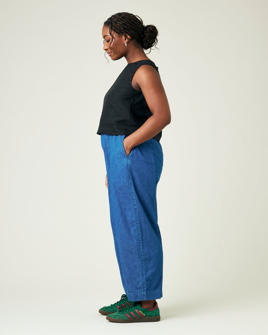 model wears mid wash chambray mabel trousers