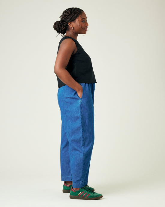 model wears mid wash chambray mabel trousers